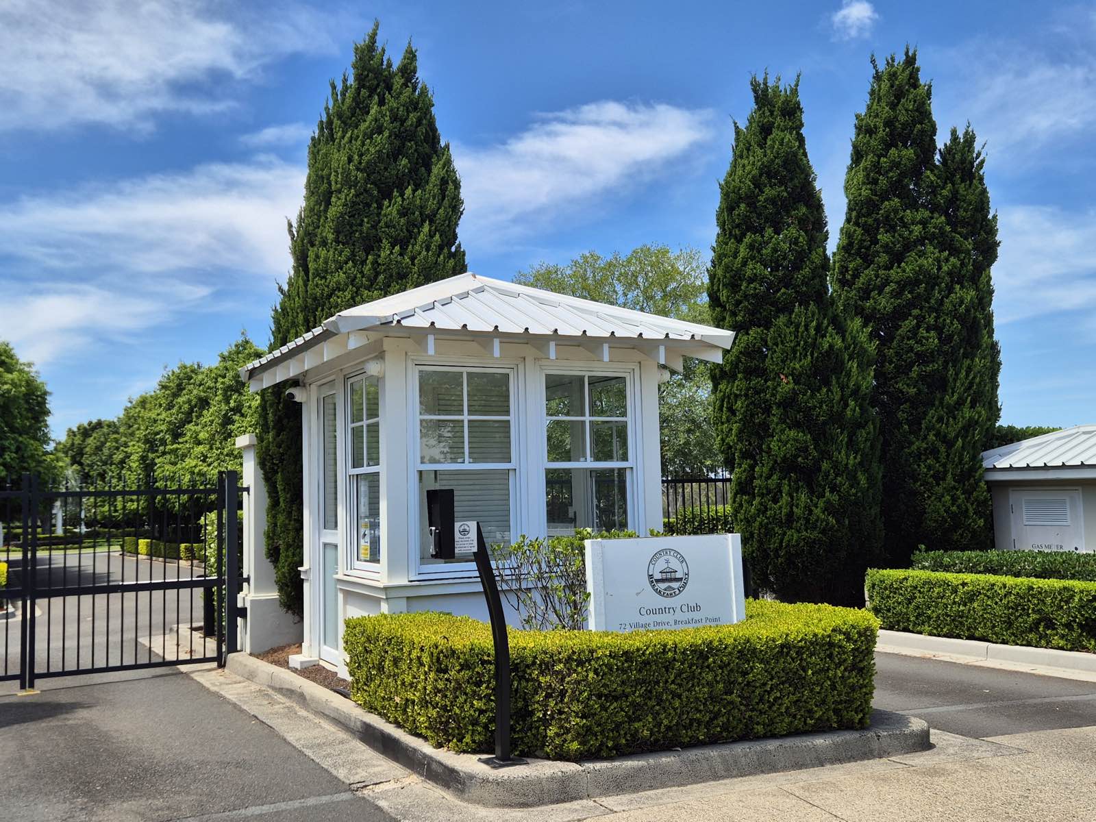 The manned gatehouse at 72 Village Drive, the entry to the Country Club grounds