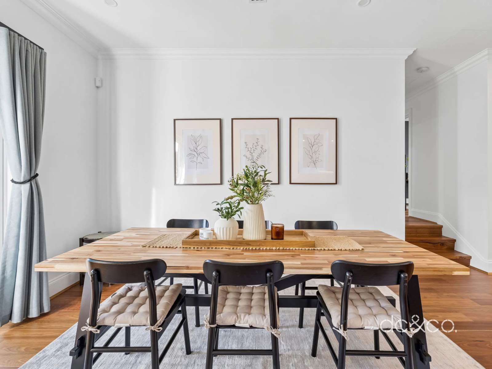 Dining room with the three timber steps up to the bedroom wing visible beyond